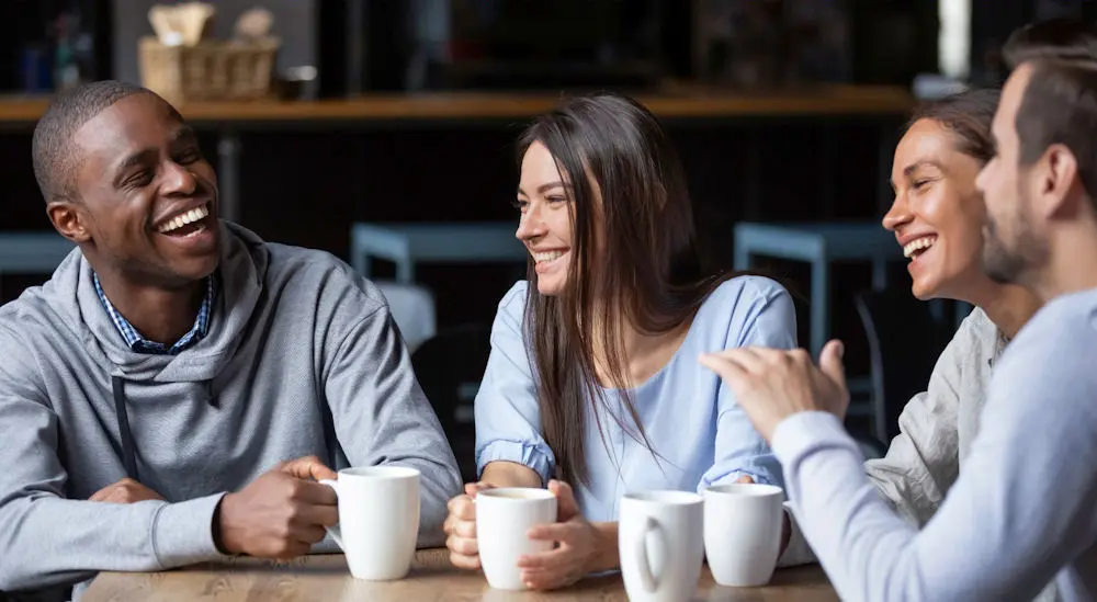 Group of friends enjoying coffee while discussing Dry January.
