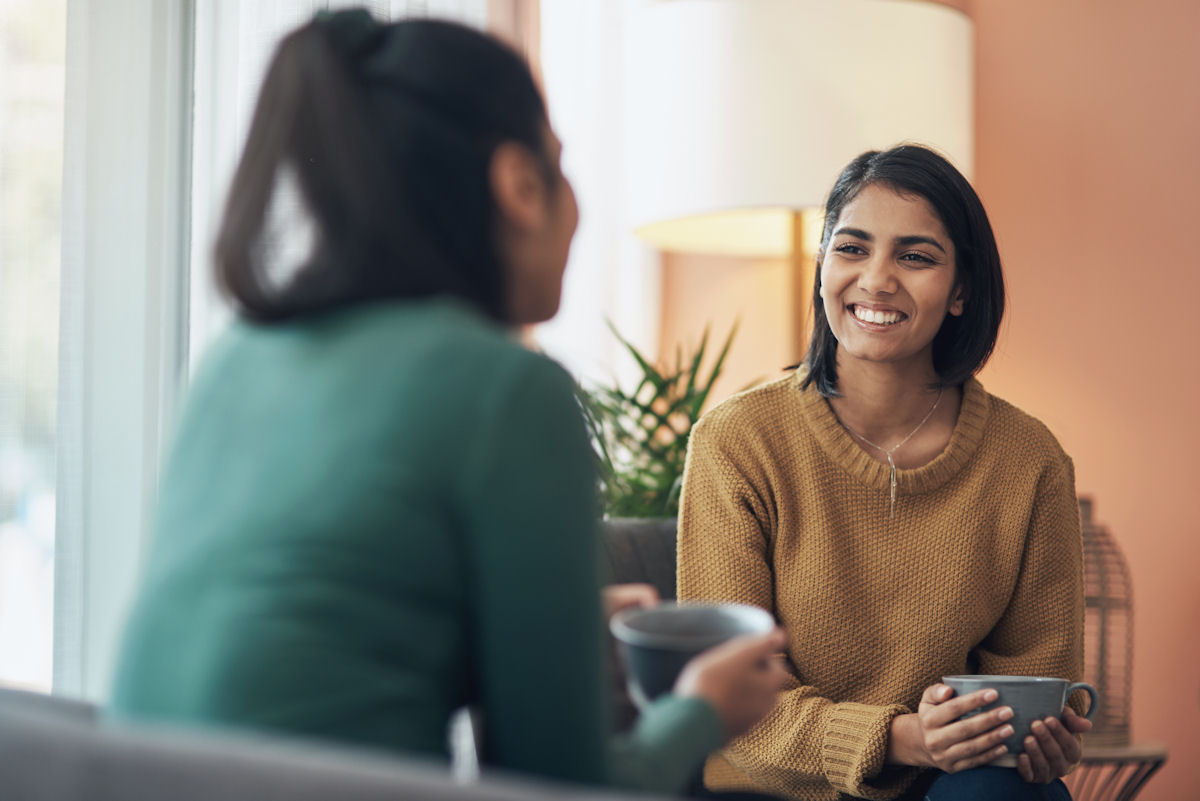 woman speaking with therapist about mental health