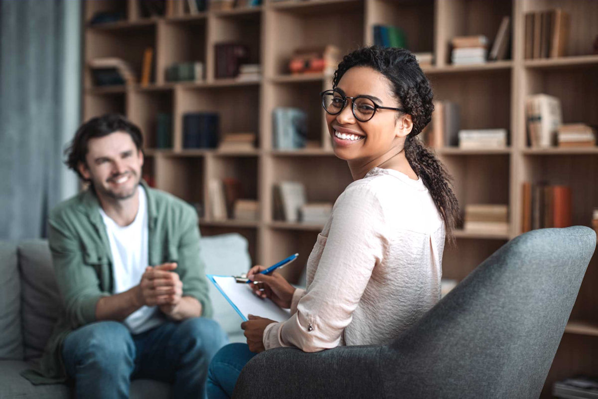 therapist ina session with a man who struggles with depression