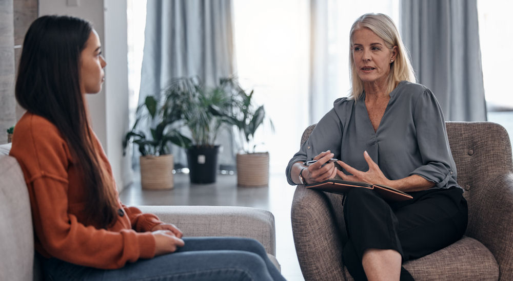 therapist doing an intake interview with client for admissions