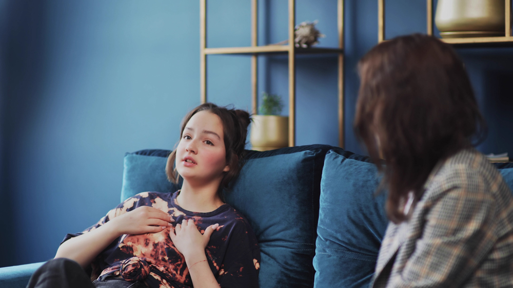 Young woman gesturing during individual therapy for addiction