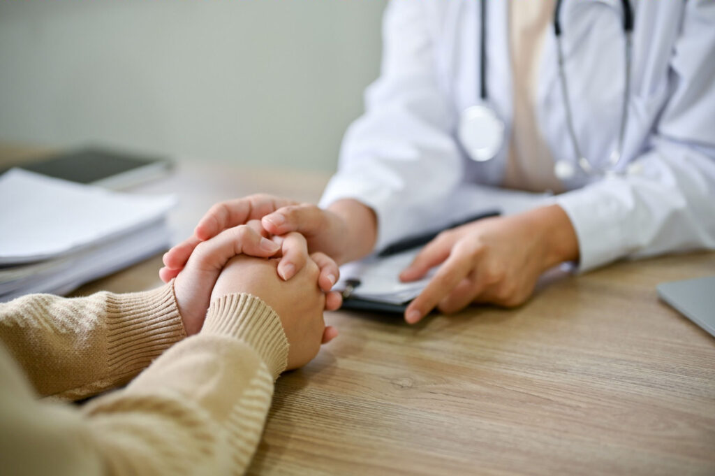 a woman speaking to a doctor