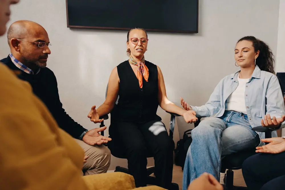 Meditation teacher guiding a group meditation session for people with PTSD.